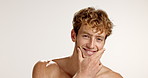 Confident, beauty or face of man with space, facial treatment or wellness in studio. Grooming, portrait or proud person on white background with smile, model or mockup for glow or natural skincare