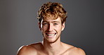 Studio, man and face with laugh for skincare, dermatology and happy with confidence for model. Mockup space, male person and smile in portrait for cosmetics, smooth and wellness in gray background