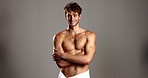 Studio, man and face with confidence for skincare, dermatology and happiness with body in towel. Mockup, male person and model in portrait for cosmetics, arms crossed and wellness in gray background