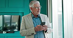 Business, phone and thinking with mature man in office for financial or portfolio management. App, communication and finance with corporate employee in workplace for investment, planning or trading