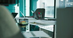 Vacant, boardroom and paperwork on desk, tech and financial report for meeting or corporate company. Empty, chairs and workplace with laptop for training session, documents and data on table in room