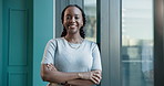 Business, face and black woman with crossed arms for confidence, pride or about us in finance office. Corporate, professional and portrait of person by window for financial consultant, career and job
