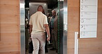 Walking, man and colleagues in elevator, door and arrival at company, morning and travel to meeting. Open, lift or friendly people at work, team or together in transport to floor or level in building