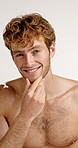 Face, beauty and man in studio for body care, muscle and skincare on white background. Portrait, dermatology and  happy male model with cosmetics, natural aesthetic and confidence with facial hair