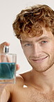 Face, happy man and spray perfume in studio for fragrance, hygiene and fresh scent. Portrait, luxury cologne and model with cosmetics product for beauty, self care and clean smell on white background
