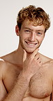 Beauty, face and smile of shirtless man in studio for masculine health, hygiene or wellness. Aesthetic, body and skincare with happy or muscular model on white background for cosmetics or dermatology