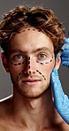 Plastic surgery, skincare and face of man in studio for facial treatment, facelift and beauty. Dermatology, gray background and portrait of person with injection for cosmetics, aesthetics and change