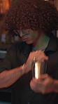 Bartender, drink mixing and man in club, service and skills for cocktails, happy hour and hospitality. Person, expert and employee with alcohol beverage, night and mixologist with party and shaking