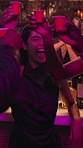 Cheers, shots and friends at bar in club with fun, excitement and party together at night. Smile, toast and group of people with alcohol drinks for happy hour at social gathering, event or reunion.
