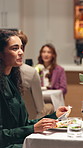 Happy woman, eating and fine dining with food for dinner date or hospitality in restaurant. Female person, smile and enjoying meal with plate for healthy cuisine, conversation or catering service