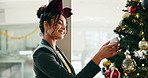 Woman, office or hanging bauble on christmas tree for work decoration, tradition or festive season. Business, employee and happy with ornament for xmas aesthetic, creativity and holiday celebration