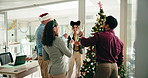 Business people, champagne and toast at Christmas tree with team, happy and festive event at company. Men, women and smile for celebration, drinks or sparkling wine for xmas party at insurance agency
