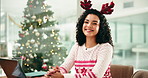Woman, laptop and smile at Christmas in office with face, feedback and typing report at media company. Person, computer and writer in portrait at xmas with reindeer hat at creative agency in Brazil