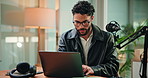 Happy, laptop and man with mic in studio for podcast, editing broadcast and recording with tech. Content creation, production and person on computer for audio, radio presenter and hosting show