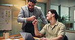 Fist bump, laptop and web design with business people in office at night for project management. Computer, development and success with employee friends in workplace for programming milestone