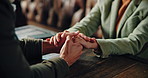 Holding hands, closeup or couple in cafe on date together for love, communication or anniversary. Connection, care or romantic people bonding in restaurant for conversation, support and gratitude