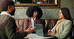 Meeting, laptop and business people in coffee shop for planning creative project with publishing. Computer, collaboration and editors with author for discussion on proofreading in restaurant cafe.