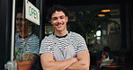 Happy man, face and small business with confidence at cafe for entrepreneurship or ownership. Portrait, male person or waiter with smile, arms crossed or open sign by door for startup in coffee shop