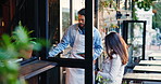Welcome, restaurant and waiter with woman at door for friendly service, opening and hospitality. Diner, cafe and man with customer at entrance for small business, opening and coffee shop startup