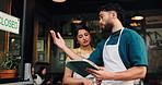 Waiter, team and talk with tablet at cafe, closed sign or review for menu, checklist or stock at front door. Man, woman and barista with planning, tech or app for results, solution or advice at diner