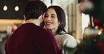 Happy couple, relax or slow dancing with christmas tree for holiday, weekend or romance in home. Man, woman and smile with hug or embrace for december, festive celebration or moment together in house