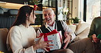 Christmas, happy woman and senior dad with gift for family, support and festive celebration. Love, home or elderly parent giving present for gratitude, thank you or exchange for holiday tradition