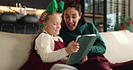Christmas surprise, mother and happy child with tablet on sofa for festive meme or family laugh. Xmas, daughter and mom with tech in home for funny game, wow or scroll app for bonding on holiday