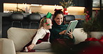 Christmas, mom and happy kid with tablet in home for festive movie, learning and scroll online store. Xmas, girl child and mother with tech on sofa for holiday film, decoration ideas or gift shopping