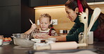 Baking, mother and child with ingredients on Christmas for cake recipe, festive cookies or learning. Happy family, people and mixing batter in home for santa snacks, instructions and bonding together
