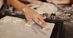 Baking, Christmas and hands of parent with child in kitchen of home for bonding or festive celebration. Cookies, cooking or helping with family in apartment together to prepare biscuits for holidays