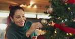 Christmas tree, decoration and smile with woman in living room of home for winter celebration event. Cheer, December and holidays with happy person getting ready for festive season in apartment