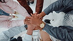 Hands together, business people and team building in office for unity, solidarity and motivation. Men, women and collaboration for goal, success and celebration from above staff with applause for win