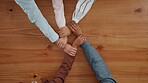 Business, people and holding hands on table in office for partnership, teamwork and success. Above, collaboration and motivation with employees synergy, goal celebration and solidarity of achievement