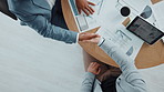 Colleagues, project and handshake for agreement, paperwork and team with deal for merger or meeting. Above, people or shaking hands for collaboration in boardroom, documents and success of investment