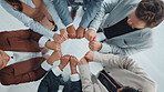 Business people, hands and fist bump in circle for collaboration, teamwork and synergy. Above, group and applause in office with gesture, solidarity and workforce integration for company cooperation