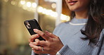 Phone, hands and woman in home at night for text, romantic message and internet notification. Mobile, person and communication for social media, chat and download app for online dating with bokeh