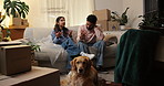 Frustrated couple, fight and debt with boxes for eviction notice, move or home migration. Conflict, man and woman with disagreement or argument for bankruptcy, mortgage crisis or house repossession