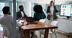 Woman, meeting and graphs on screen in office for accounting, financial report and review budget. People, explain and teamwork for finance, sales charts and stats for funding pitch of risk assessment
