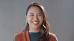 Face, smile and woman laughing in studio for comedy screenwriter, script author and career pride. Portrait, female director and about us for humor, funny joke and positive attitude on gray background