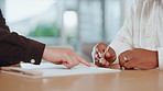 Agreement, pointing and signature with handshake of business people in office for contract or deal. Documents, hiring and recruitment with employee shaking hands in workplace for bonus or promotion