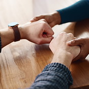 Forgive, support and couple holding hands on table for love, apology ...