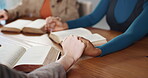 Praying, group and Christian with bible, holding hands or worship Jesus Christ, together and belief. Religious, community and people with scripture for fellowship, praise and respect for holy spirit