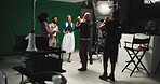 Director, applause and high five with cast for good job, well done or finished in production studio. Group, producer or celebration with team success for commercial, filmmaking or acting on set