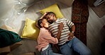 Tired, couple and sleeping on floor of new home for unpacking fatigue, mortgage purchase or moving. Above, exhausted and black people with rest together in house for relocation or property investment