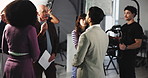 Director, actor and instructions with script for video production, commercial or filmmaking. Group, team and cast listening with producer assistance for acting help, tips or recording scene on set