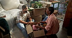 Moving in, couple and unpacking boxes in new house for relocation, property purchase and teamwork. Laugh, black people and help with unboxing clothes in first home with real estate success and above