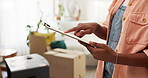 Person, hands and home with clipboard for checklist, inventory or stock control in new house. Closeup, boxes and documents with paperwork or insurance policy for relocation or move in apartment