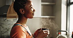 Home, thinking and black woman in kitchen, coffee and steam with contemplation, window and calm. African person, apartment and girl with herbal tea, warm and decision with ideas and daydreaming