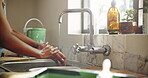 Washing hands, soap and remodeling with woman in kitchen for chemical safety, hygiene and water. Cleaning, painting disinfection and renovation with person and kitchen sink in home for diy project