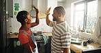 Happy, black couple or teamwork with high five in kitchen for painting, home improvement or success. Excited, man and woman with joy for DIY, house repair or renovation together in apartment building